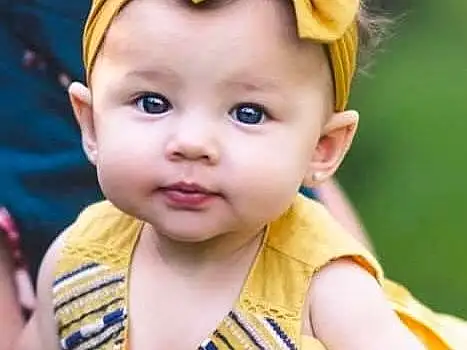 Child, Toddler, Yellow, Baby, Skin, Cheek, Child Model, Headband, Hair Accessory, Headgear, Smile, Baby Products, Happy, Play, Person