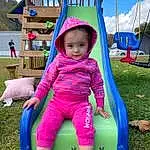 Cloud, Blue, Green, Purple, Sky, Pink, Grass, Leisure, Baby & Toddler Clothing, Fun, Toddler, Magenta, Recreation, Happy, Child, Play, Chute, Outdoor Furniture, Outdoor Play Equipment, City, Person