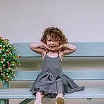 Smile, Dress, Happy, Toddler, Knee, Picture Frame, Wood, Human Leg, Fun, Event, Fashion Design, Table, Barefoot, Room, Sitting, Leisure, Thigh, Foot, Flower, Waist, Person