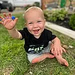 Smile, Skin, Plant, Hand, People In Nature, Leaf, Happy, Tree, Gesture, Finger, Grass, Toddler, Leisure, Baby & Toddler Clothing, Fun, Recreation, Thumb, Lawn, T-shirt, Person, Joy