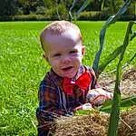 Plant, Eyes, People In Nature, Nature, Leaf, Botany, Smile, Grass, Happy, Baby & Toddler Clothing, Toddler, Baby, Terrestrial Plant, Lawn, Child, Agriculture, Garden, Spring, Grassland, Person
