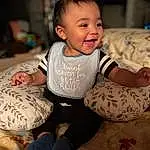 Cheek, Skin, Head, Smile, Hairstyle, Eyes, Facial Expression, Comfort, Sleeve, Baby & Toddler Clothing, Baby, Happy, Toddler, Flash Photography, Child, Wood, Fun, T-shirt, Sitting, Person
