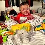 Head, Smile, Photograph, White, Textile, Toy, Happy, Baby, Toddler, Child, Baby & Toddler Clothing, Fun, Event, Leisure, Linens, Stuffed Toy, Room, Play, Baby Toys, Sitting, Person, Joy
