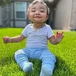 Face, Smile, Facial Expression, Plant, People In Nature, Happy, Grass, Baby & Toddler Clothing, Sunlight, Toddler, Playing With Kids, Meadow, Grassland, Leisure, Groundcover, Fun, Flash Photography, Lawn, Child, Baby, Person, Joy