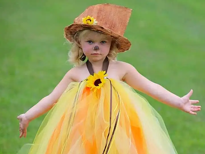 Clothing, Yellow, Dress, Child, Costume, Peach, Plant, Gown, Person, Headwear