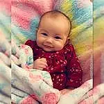 Cheek, Skin, Facial Expression, Dress, Baby, Smile, Textile, Happy, Sleeve, Baby & Toddler Clothing, Pink, People In Nature, Toddler, Child, Magenta, Comfort, Linens, Pattern, Art, Person, Joy