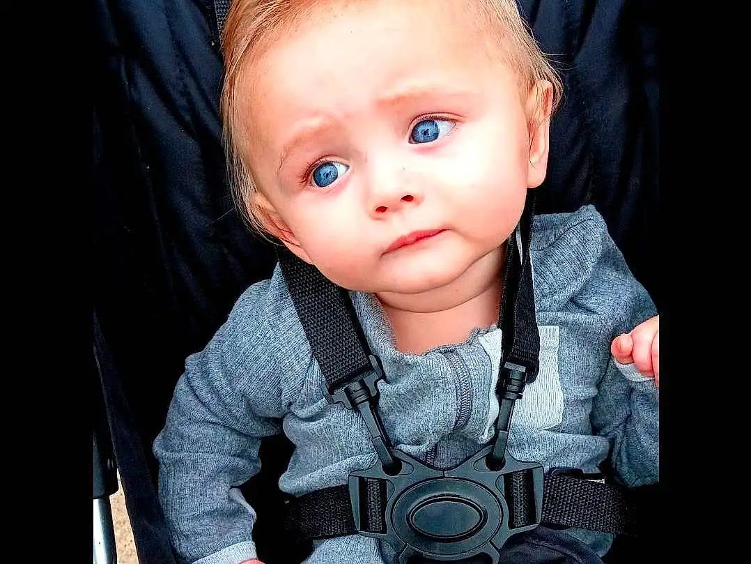Cheek, Skin, Chin, Eyes, Fashion, Flash Photography, Textile, Sleeve, Cool, Baby & Toddler Clothing, Baby, Electric Blue, Toddler, Toy, Baby Products, Baby Carriage, Sitting, Child, Thumb, Person