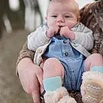 Cheek, Skin, Hand, Baby & Toddler Clothing, Happy, People In Nature, Gesture, Finger, Baby, Pink, Toddler, Grass, Fun, Toy, Thumb, Wool, Glove, Child, Person