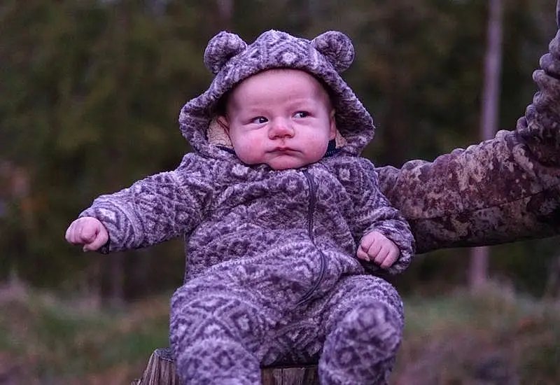 People In Nature, Tree, Sleeve, Sky, Gesture, Happy, Baby & Toddler Clothing, Wood, Flash Photography, Smile, Toddler, Grass, Leisure, Recreation, Fun, Child, Winter, Sitting, Baby, Forest, Person, Headwear