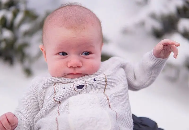 Nose, Cheek, Skin, Lip, Outerwear, Sleeve, Happy, Baby, Gesture, Smile, Baby & Toddler Clothing, Finger, Toddler, Comfort, Furry friends, Fun, Grass, Sitting, Child, Freezing, Person