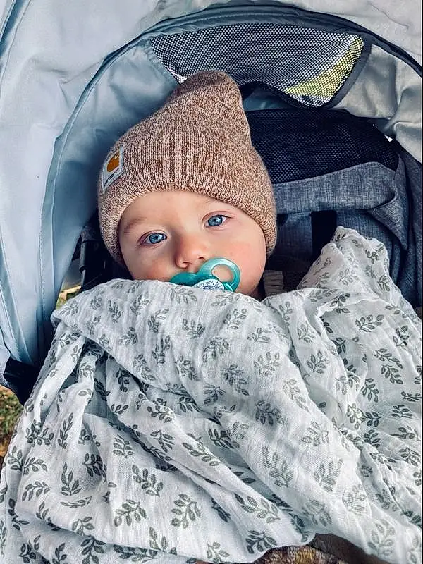 Face, Cheek, Skin, Head, Outerwear, Eyes, Comfort, Textile, Cap, Sleeve, Baby, Baby Sleeping, Cool, Toddler, Baby & Toddler Clothing, Linens, Knit Cap, Child, Electric Blue, Baby Products, Person, Headwear