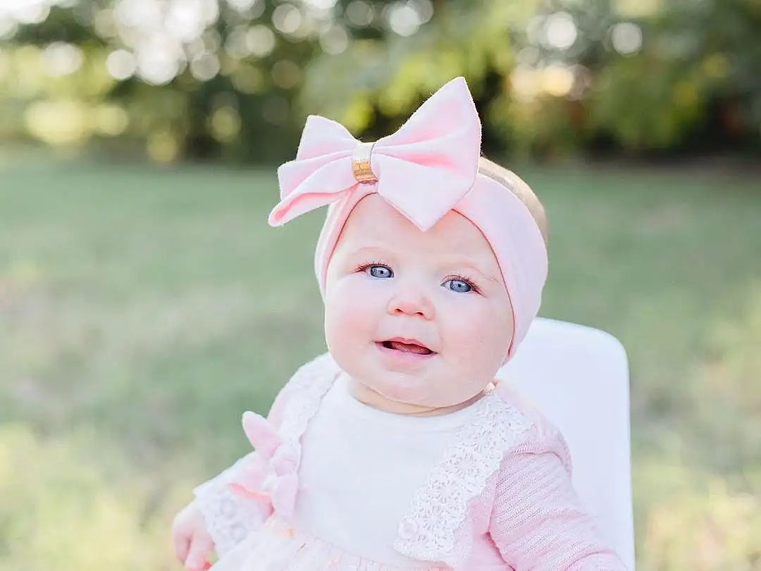 Child, Pink, Photograph, Face, Baby, Head, Skin, Toddler, Headgear, Hair Accessory, Photography, Portrait Photography, Ear, Happy, Smile, Person, Headwear