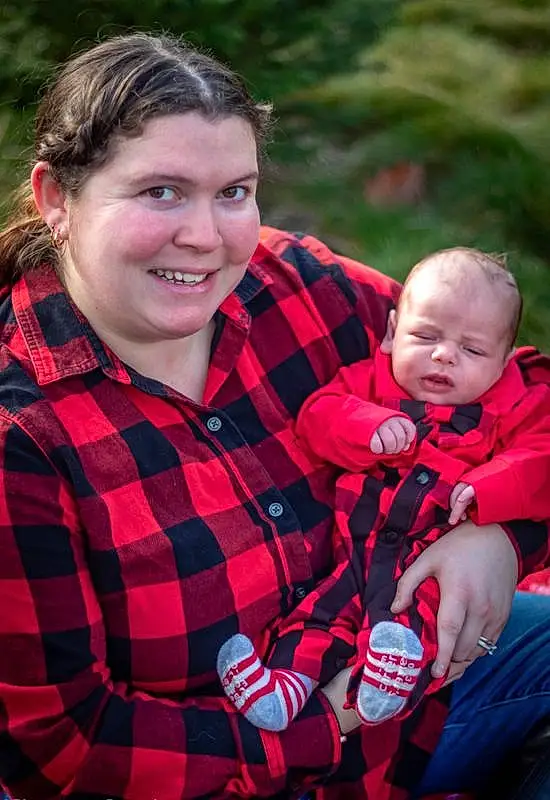 People, Face, Red, Child, Plaid, Pattern, Tartan, Toddler, Tree, Smile, Design, Leaf, Eyes, Textile, Vacation, Grass, Photography, Family, Plant, Person, Sorrow, Joy