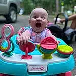 Skin, Hairstyle, Mouth, Table, Baby & Toddler Clothing, Happy, Pink, Grass, Leisure, Chair, Fun, Toddler, Public Space, Smile, Summer, Recreation, Baby, Baby Products, Magenta, Baby Playing With Toys, Person