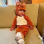 Comfort, Textile, Orange, Wood, Child, Fun, Toddler, Knee, Linens, Baby, Room, Happy, Sock, Sitting, Bedding, Thigh, Couch, Leisure, Toy, Person, Headwear