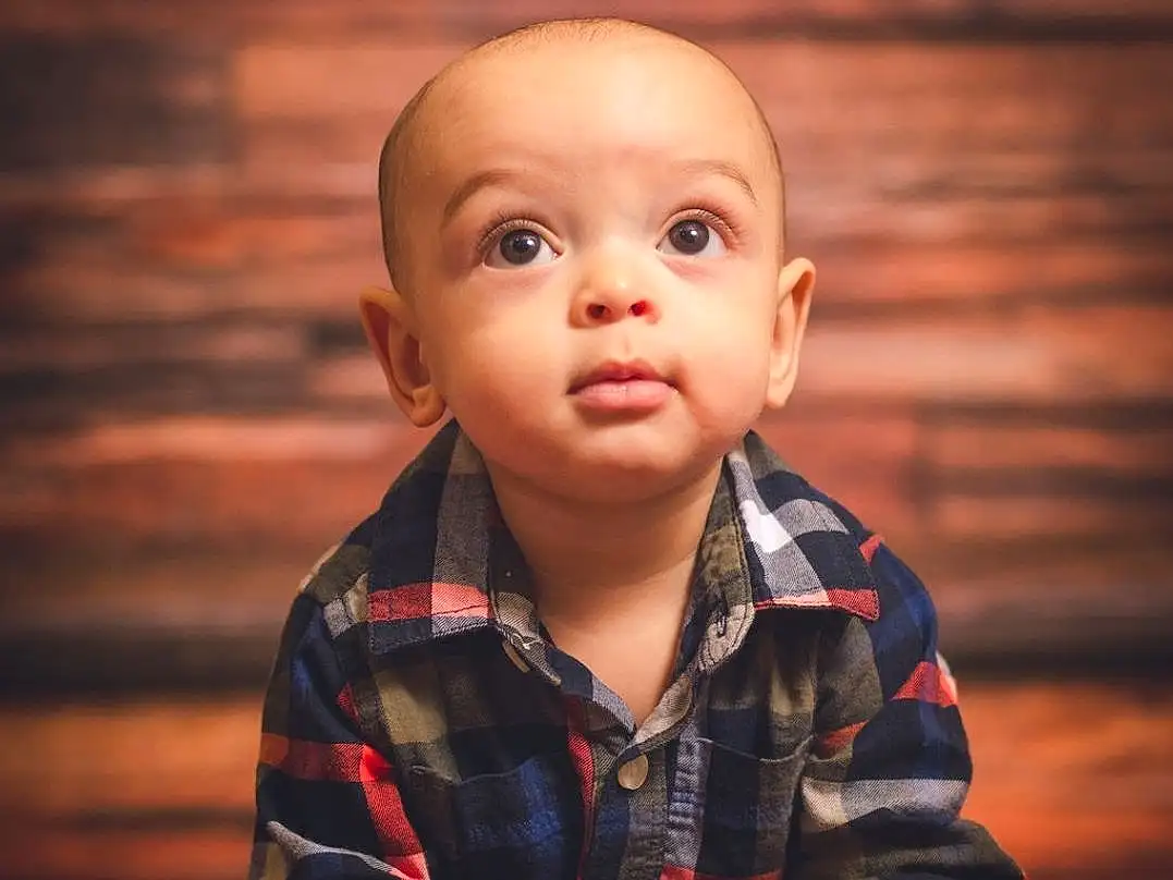 Face, Cheek, Skin, Head, Hand, Arm, Eyes, Flash Photography, Sleeve, Wood, Gesture, Happy, Toddler, Baby, Child, Fun, Baby & Toddler Clothing, Plaid, Darkness, Person