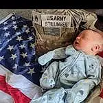 Sleeve, Textile, Baby & Toddler Clothing, Comfort, Baby, Toddler, Linens, Pattern, Child, Baby Sleeping, Baby Products, Baby Carriage, Flag Of The United States, Hat, Sitting, Font, Bedding, Furry friends, Nap, Person