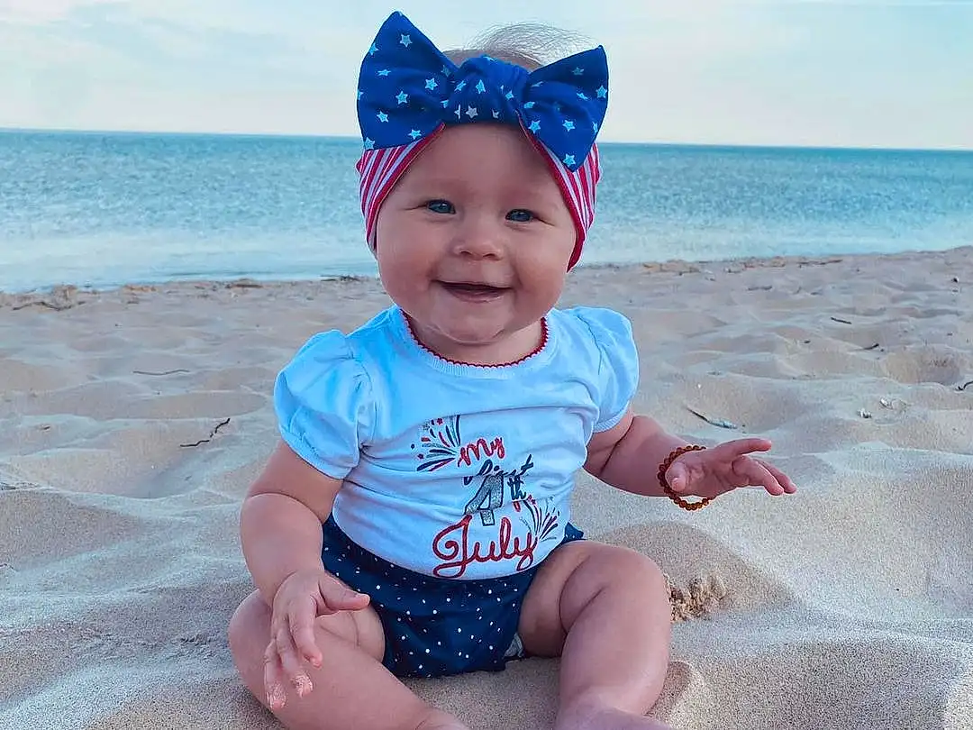 Face, Water, Smile, Sky, Cloud, Blue, Azure, Hat, Baby & Toddler Clothing, Sleeve, Standing, Beach, Sunlight, Happy, Pink, Toddler, Fun, Morning, Baby, Person, Joy, Headwear