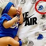 Joint, Photograph, White, Azure, Sleeve, Gesture, Baby & Toddler Clothing, Finger, Shorts, Font, Toddler, Elbow, Electric Blue, Baby, T-shirt, Sportswear, Thigh, Child, Thumb