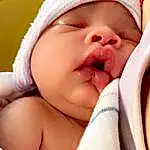 Nose, Cheek, Skin, Lip, Chin, Eyebrow, Eyes, Facial Expression, Mouth, Comfort, Baby, Finger, Toddler, Pink, Eyelash, Thumb, Gesture, Child, Beauty, Baby Sleeping, Person