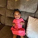 Smile, Eyes, Couch, Comfort, Dress, Textile, Wood, Leisure, Thigh, Toddler, Living Room, Baby & Toddler Clothing, Happy, Human Leg, Sitting, Foot, Day Dress, Fun, Person, Joy
