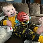 Arm, Couch, Leg, Comfort, Sports Equipment, Football, Ball, Finger, Smile, Toddler, Child, Happy, Knee, Grass, Fun, Foot, Baby, Sitting, Person