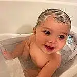 Cheek, Smile, Baby Bathing, Bathtub, Water, Eyes, Bathroom, Jaw, Ear, Fluid, Iris, Bathing, Happy, Chest, Baby, Plumbing, Liquid, Toddler, Eyelash, Fun, Person, Joy