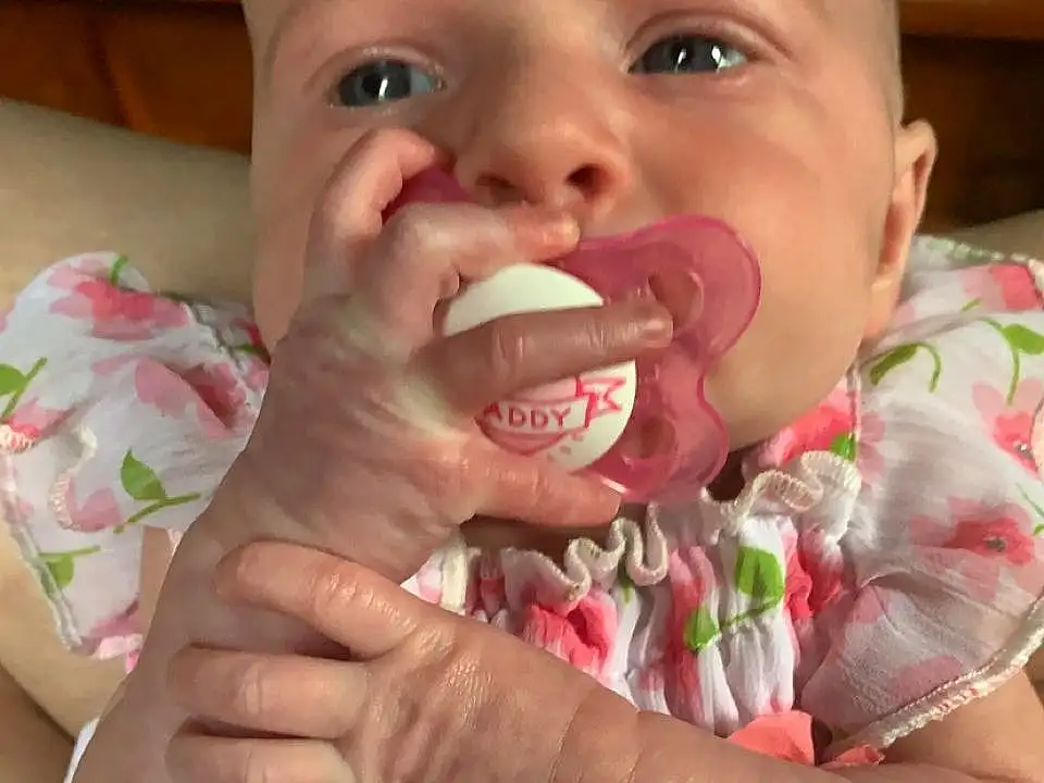 Nose, Cheek, Skin, Lip, Hand, Arm, Mouth, White, Green, Tooth, Textile, Tongue, Baby & Toddler Clothing, Happy, Baby, Pink, Gesture, Finger, Toddler, Person