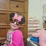 Blue, Goggles, Purple, Pink, Sunglasses, Eyewear, Toddler, Smile, Cabinetry, Baby & Toddler Clothing, Child, Personal Protective Equipment, Fun, Event, Happy, Magenta, Room, Wood, Sitting, Holiday, Person