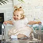 Skin, Smile, Dress, Flash Photography, Happy, Toddler, Summer, Baby, Toy, Event, Child, Blond, Bridal Clothing, Fun, Leisure, Sitting, Jewellery, Fashion Accessory, Chair, Baby Products, Person, Joy