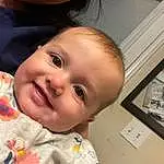 Forehead, Nose, Smile, Cheek, Skin, Lip, Chin, Hairstyle, Eyebrow, Eyes, Facial Expression, Mouth, Baby & Toddler Clothing, Baby, Happy, Iris, Sleeve, Person, Joy