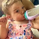Nose, Face, Cheek, Skin, Joint, Head, Lip, Hand, Hairstyle, Arm, Mouth, Facial Expression, Drinkware, Eyelash, Neck, Baby Bottle, Baby & Toddler Clothing, Gesture, Plastic Bottle, Person