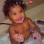 Cheek, Smile, Skin, Head, Baby Bathing, Arm, Water, Mouth, Bathroom, Fluid, Bathing, Plumbing Fixture, Bathtub, Pink, Foam, Toddler, Chest, Plumbing, Liquid, Baby, Person
