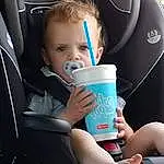 Head, Drinkware, Comfort, Automotive Design, Toddler, Child, Car Seat, Fun, Head Restraint, Nail, Vroom Vroom, Cup, T-shirt, Leisure, Drinking, Steering Wheel, Sitting, Family Car, Car Seat Cover, Person