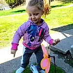 Jeans, Smile, Plant, Shoe, People In Nature, Leaf, Baby & Toddler Clothing, Happy, Toddler, Grass, Tree, Recreation, Leisure, Lawn, Toy, Child, Baby Carriage, Fun, Baby, Sitting, Person