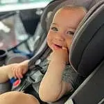 Smile, Hand, Car, Facial Expression, Steering Part, Vroom Vroom, Automotive Design, Comfort, Car Seat Cover, Head Restraint, Steering Wheel, Car Seat, Vehicle, Vehicle Door, Automotive Exterior, Toddler, Personal Luxury Car, Auto Part, Child, Person
