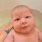 Nose, Cheek, Skin, Lip, Hand, Smile, Eyebrow, Arm, Mouth, Baby Bathing, Neck, Human Body, Water, Fluid, Eyelash, Stomach, Baby, Iris, Chest, Bathing, Person