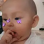 Forehead, Nose, Cheek, Skin, Lip, Eyebrow, Mouth, Eyelash, White, Ear, Neck, Jaw, Iris, Gesture, Baby & Toddler Clothing, Happy, Toddler, Baby, Nail, Thumb, Person, Blurred