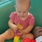 Cheek, Skin, Joint, Hand, Baby Playing With Toys, Arm, Photograph, Mouth, Facial Expression, Leg, Human Body, Baby, Fun, Yellow, Finger, Toy, Toddler, Leisure, Person