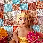 Face, Eyes, Textile, Pink, Baby, Happy, Art, Toddler, Magenta, Linens, Child, Petal, Beauty, Pattern, Room, Bedding, Event, Chair, Fashion Accessory, Person, Headwear