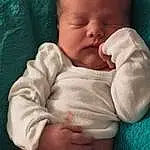 Nose, Cheek, Skin, Chin, Hand, Mouth, Comfort, Human Body, Sleeve, Baby & Toddler Clothing, Baby, Gesture, Finger, Baby Sleeping, Toddler, Thumb, Linens, Child, Abdomen, Chest, Person