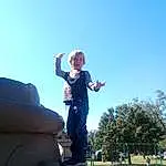 Sky, Plant, Gesture, Tree, Happy, Travel, Leisure, Toddler, Fun, City, Recreation, Monument, Landscape, Sitting, Child, Shadow, Vacation, Person