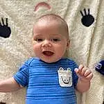 Face, Cheek, Skin, Smile, Eyes, Baby & Toddler Clothing, Textile, Neck, Sleeve, Baby, Pink, Finger, Happy, Toddler, T-shirt, Child, Pattern, Linens, Electric Blue, Person