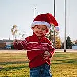 Clothing, Smile, Sky, Plant, Tree, Cap, Happy, Standing, Flash Photography, Gesture, Grass, Hat, Toddler, Child, Leisure, People, Grassland, Fun, Landscape, Baby, Person, Joy, Headwear