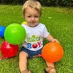 Playing Sports, Leg, People In Nature, Happy, Toy, Grass, Balloon, Fun, Leisure, Recreation, Toddler, Lawn, Thigh, Party Supply, Human Leg, Games, Child, Ball, Sports Toy, Shorts, Person