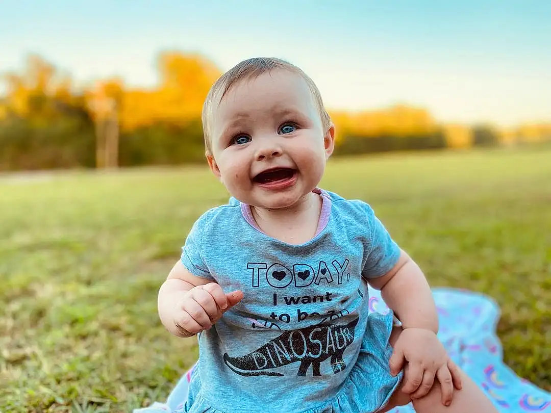 Skin, Smile, Sky, Plant, People In Nature, Happy, Flash Photography, Sleeve, Baby & Toddler Clothing, Sunlight, Grass, Baby, Toddler, Leisure, Summer, Grassland, Meadow, Fun, Child, Person, Joy