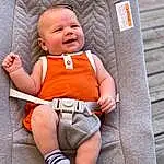 Skin, Smile, White, Comfort, Baby & Toddler Clothing, Textile, Sleeve, Orange, Baby, Sock, Toddler, Thigh, Knee, Sneakers, Human Leg, Sitting, Child, Baby Products, Lap, Foot, Person, Joy
