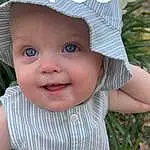 Cheek, Skin, Lip, Smile, Cap, White, Baby, Happy, Sleeve, Grass, Pink, Headgear, Hat, Plant, Baby & Toddler Clothing, Toddler, Sun Hat, Fun, Child, Baby Products, Person, Joy, Headwear
