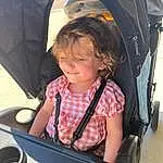 Photograph, Baby Carriage, Smile, Vroom Vroom, Toddler, Auto Part, Fun, Vehicle Door, Travel, Baby Products, Child, Automotive Exterior, Windshield, Sitting, Personal Protective Equipment, Car Seat, Tent, Chair, Person