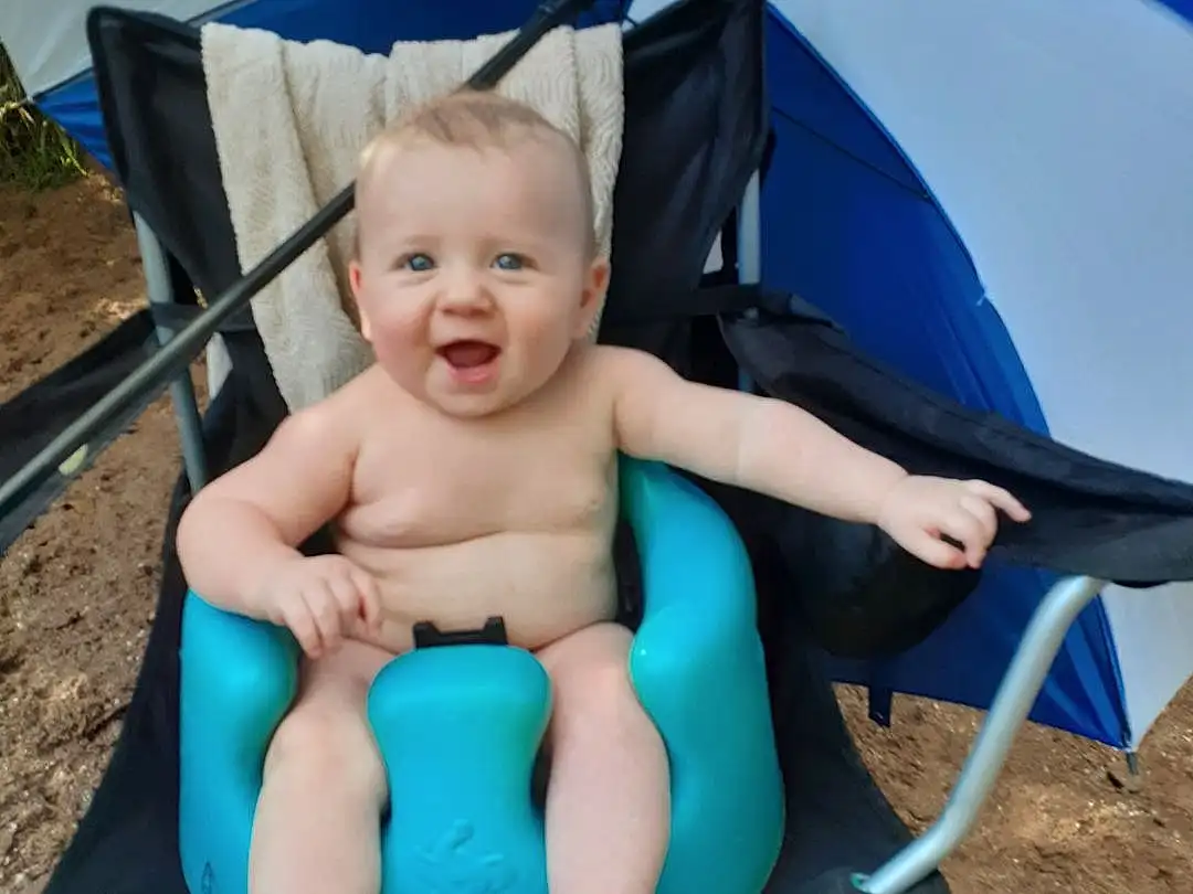Blue, Azure, Smile, Baby, Leisure, Grass, Toddler, Electric Blue, Tree, Fun, Baby Products, Thigh, Swing, Sitting, Recreation, Happy, Fashion Accessory, Chair, Soil, Child, Person